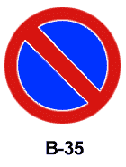 Okrągły znak drogowy B-35 z niebieskim tłem i czerwonym obramowaniem oznaczający zakaz postoju -znaki drogowe egzamin Gdańsk