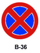 Okrągły znak drogowy B-36 z niebieskim tłem i czerwonym krzyżem oznaczający zakaz zatrzymywania sięznaki drogowe egzamin Gdańsk